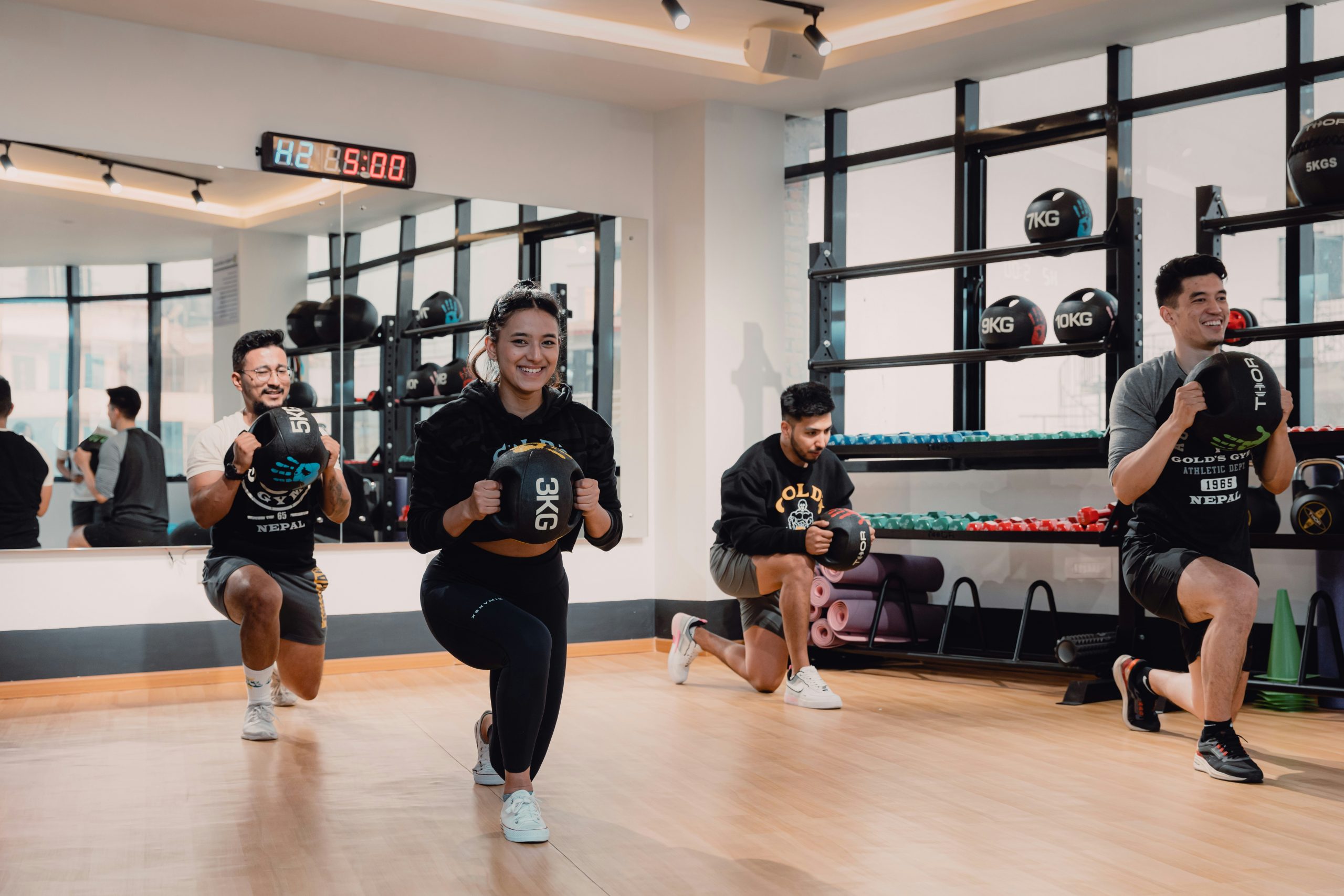 Adults training in fitness class